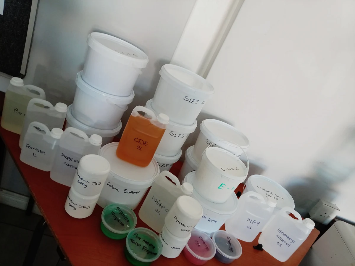 Containers of raw materials arranged on a training table